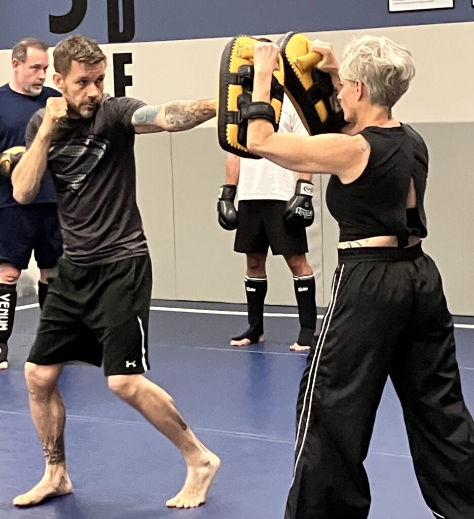 Students practicing Muay Thai striking and pad drills at Royce Gracie Academy Mount Pleasant SC