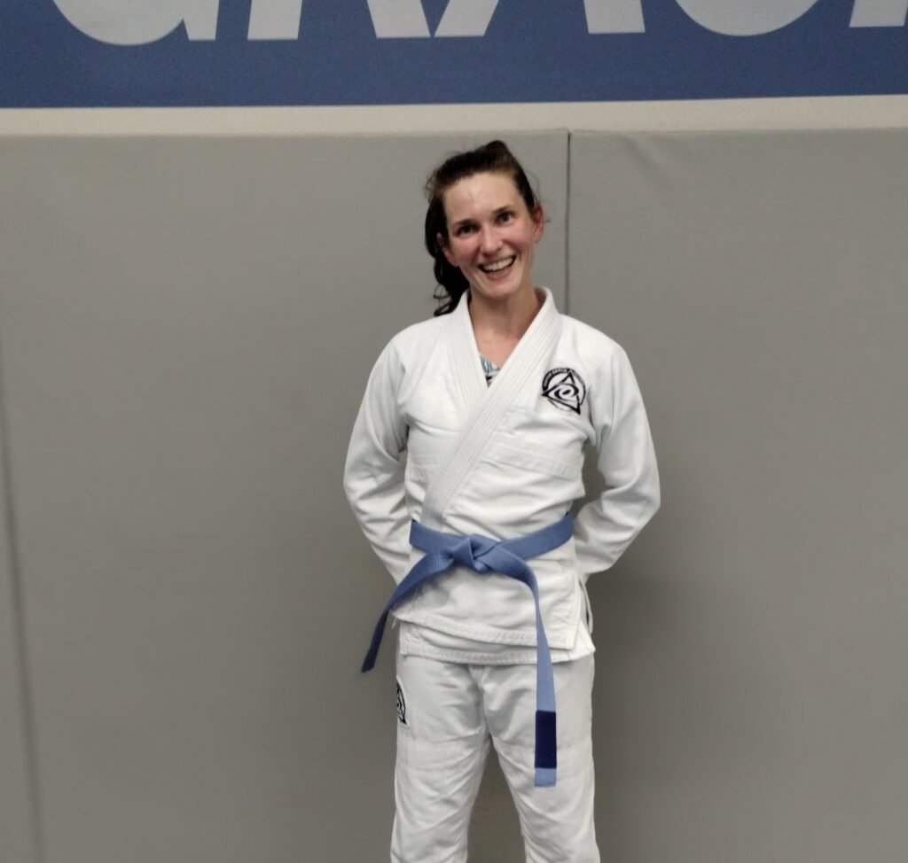Coach Amanda standing in Brazilian Jiu Jitsu gi at Royce Gracie Academy Mount Pleasant SC