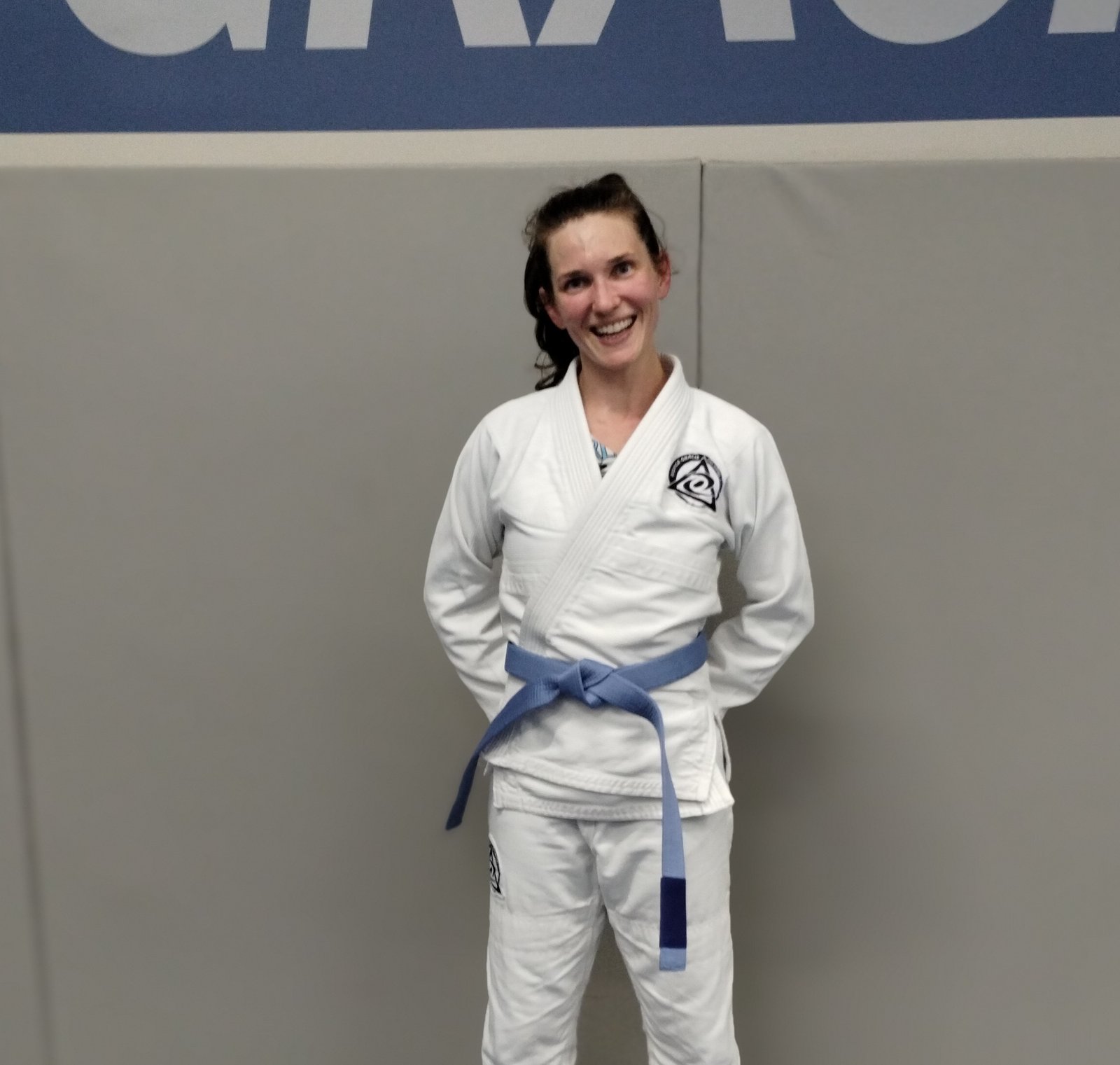 Coach Amanda standing in Brazilian Jiu Jitsu gi at Royce Gracie Academy Mount Pleasant SC