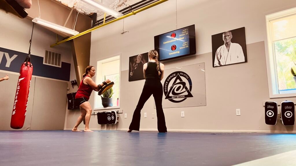 Women practicing Muay Thai pad drills at Royce Gracie Academy Mount Pleasant SC